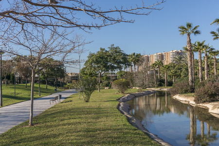 Turia River gardens Jardin del Turia, leisure and sport area. Pedestrian walk way and artificial water channel. Valencia, Spainの写真素材