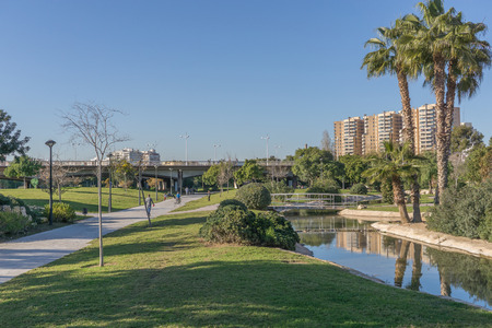 Turia River gardens Jardin del Turia, leisure and sport area. Pedestrian walk way and artificial water channel. Valencia, Spainの写真素材