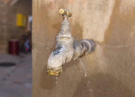 old faucet with lime deposit calcified. Faucet with water leak detaliの写真素材