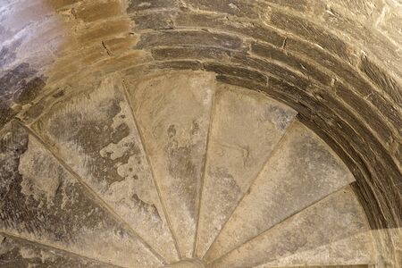 Medieval carved stone snail staircase hand carved. Bell tower on the church 16th century Late Gothic buildingの写真素材