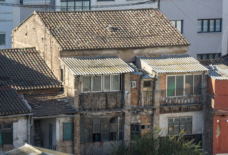 Old and deteriorated back contrafachada house in valencia in a poor and humble neighborhood.の写真素材