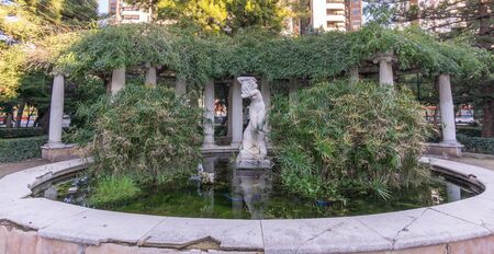 water fountain with sculpture Jardines del Real - Viveros Valencia, near old dry riverbed of the River Turiaの写真素材