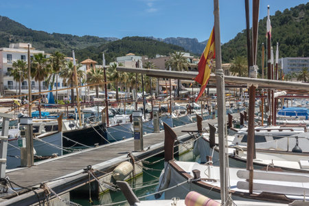 Latin sailing ships, are lined up on the jetty. Marina view port in balearic village of Port-Soller,...