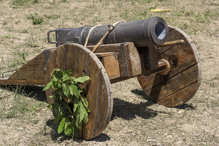 Medieval cannon Gunpowder artillery in the Middle Ages, on a reenactment. Medieval demonstration and recreationの写真素材