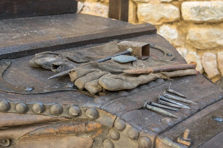 forging tools como hammer, iron parts to clear, tacks made as formerly were made, work glovesの写真素材