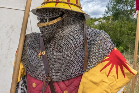 Medieval sword hilt, chainmail, sword and shields a medieval armor knight ready for battle detail. Medieval reenactmentの写真素材