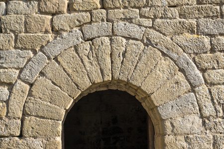 semicircular arch at the entrance of a small chapel Romanesque architecture style. half-point archの写真素材
