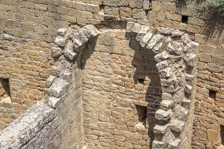 Ruined remains of the interior of an ancient medieval castle, part of the half barrel vault roof, or tunnel vault, or wagon vault. Romanesque architectureの写真素材