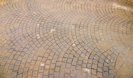 waterproof Stamped concrete pavement outdoor, mimics cobblestones pattern, wet flooring exterior, decorative appearance colors and textures of paving cobble stoneの写真素材