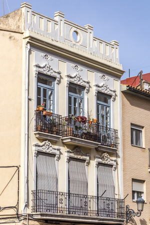 Architecture of Classical Building Facade on Old House. Exterior of White Color Apartment Building Front View. Minimalist European Style Architecture on Sunny Day.の写真素材