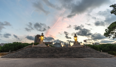 Puente del Mar, wide stairs of Sea Bridge Pedestrian bridge Valencia Spain, built in 1598, original cobblestone, and antique lamppost, wide angle, sunset, city lights lighting, night viewの写真素材
