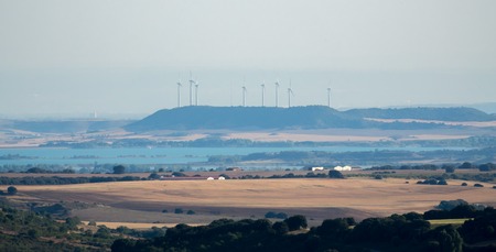 Windmill farm renewable energies wind environment sustainable economy long shot skylineの写真素材