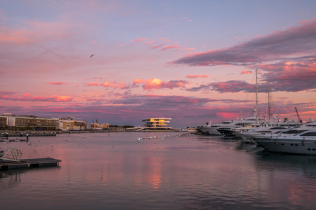sunrise at the Valencia harbor, Spain Sunset at the port of Valencia, Spain colors in the sky and water reflectionの写真素材