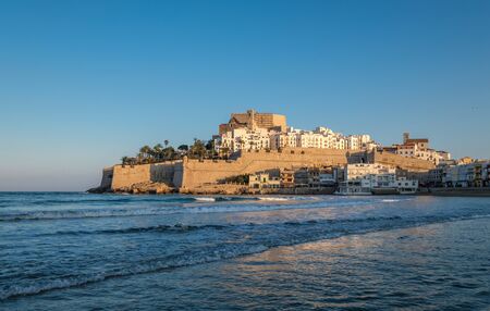 Peniscola skyline and castle beach sunset in Castellon of Spainの写真素材