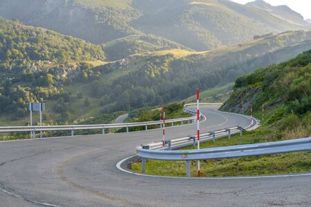 Dangerous and winding road in the high mountains peaks europeの写真素材