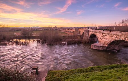 Roman bridge in Hospital de Orbigo sunset Leon Spain Camino de Santiagoの写真素材