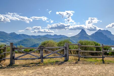 Open gate in a field in Argentina, tranquera to prevent the movement of farm animalsの写真素材