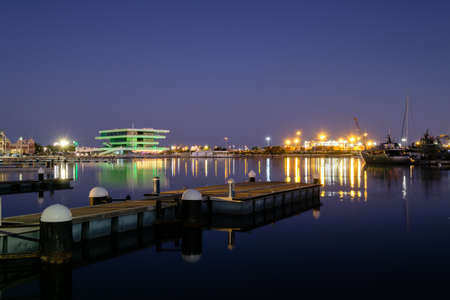 Valencia harbor, port night lights reflection in water, modern buildingsの写真素材