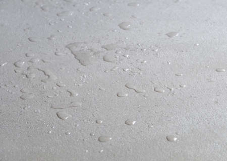 water drops on a concrete floor, microcement wet waterproof cement surfaceの写真素材