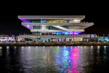 VALENCIA, SPAIN - November 2019: port, night lights reflection in water, harbor modern buildingsのeditorial素材