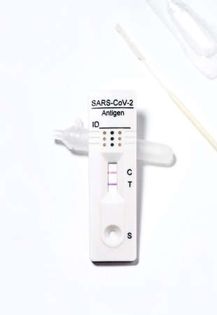 COVID-19 rapid antigen test positive result, immunochromatography of antibodies to detect infectionsの写真素材