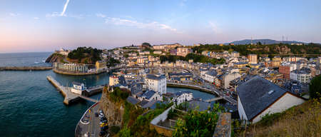 Luarca, Asturias Spain, Europe. Landscape with fishing and pleasure port with boats, harbor, sea and beach. Touristic destination, panoramic sunsetの写真素材