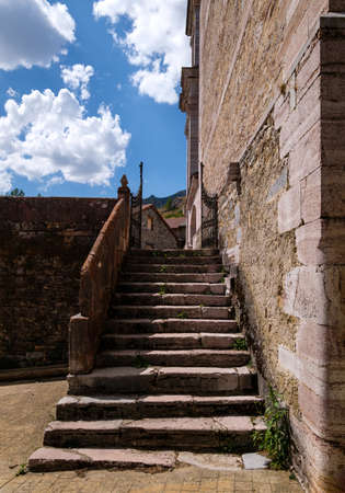 Veined red marble limestone stairs. Lois Church Cathedral Mountain, Cremenes Leon, Spain.の写真素材