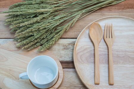 wood dish and coffe cup on wooden table.with Text Spaceの写真素材