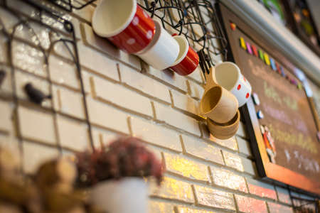 cup wooden decorated in coffee cafe with brick wallの写真素材