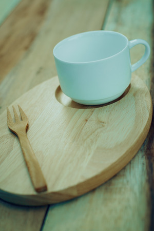 wood dish and coffe cup on wooden table.with Text Spaceの写真素材