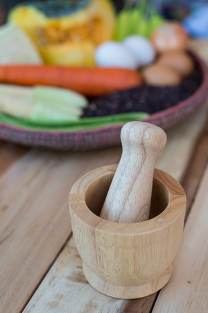 clean food,vegetables set ,wood dish and wood fork on wooden tableの写真素材