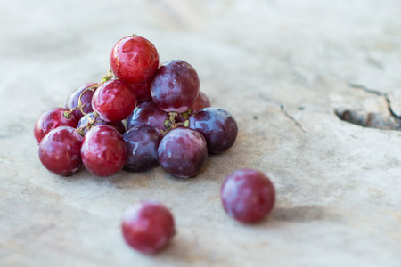 red grapes on a wooden table