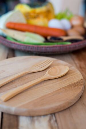 clean food,vegetables set ,wood dish and wood fork on wooden tableの写真素材