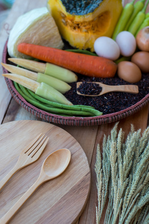 clean food,vegetables set ,wood dish and wood fork on wooden tableの写真素材