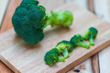 Fresh broccoli on wooden background,broccoli wooden tableの写真素材