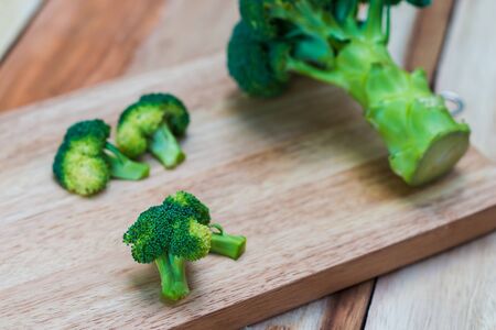 Fresh broccoli on wooden background,broccoli wooden tableの写真素材