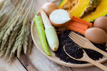 clean food,vegetables set ,wood dish and wood fork on wooden tableの写真素材