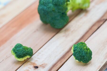Fresh broccoli on wooden background,broccoli wooden tableの写真素材