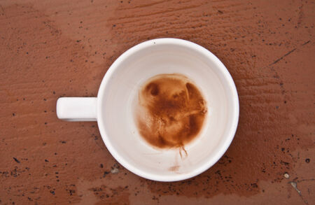 Empty of coffee cup isolated on wooden の写真素材