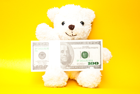 Bear holding banknoteの写真素材