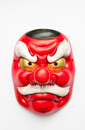 Japanese demon mask on white backgroundの写真素材