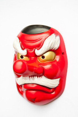 Japanese demon mask on white backgroundの写真素材