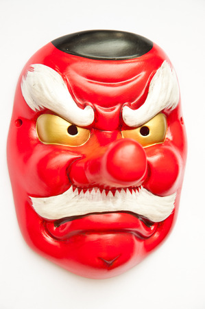 Japanese demon mask on white backgroundの写真素材