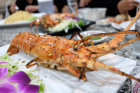 lobster with garilc on tableの写真素材