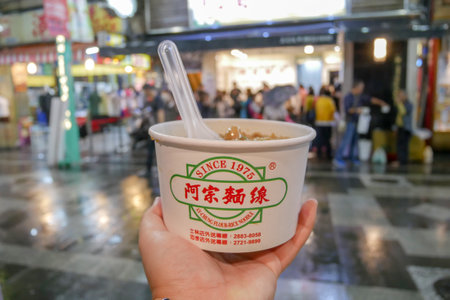 Taipei, Taiwan - October 12, 2018: Ay-Chung Flour Rice Noodle is famous food at Ximending night market, Taipeiのeditorial素材