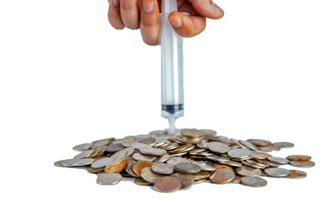 Men hand Injection put thai old coins into the pile on white backgrond