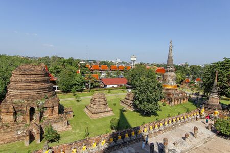 Ancient old temple in ayutthaya historical park area at thailandの写真素材