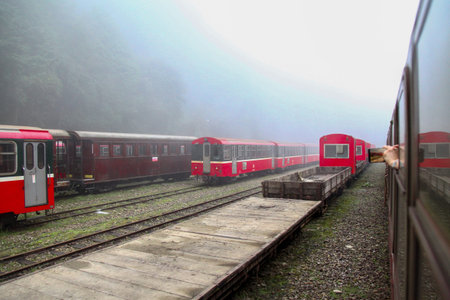 Alishan,taiwan-October 14,2018:Red train stop in foggy day at alishan train station on alishan...