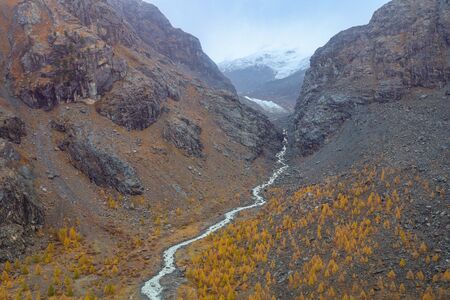View of river and landscape furi mountain in autumn season from cable car in zermatt, swissの写真素材