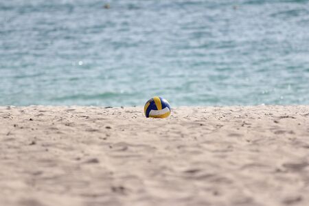 The volleyball on sand beach have sea background at thailandの写真素材